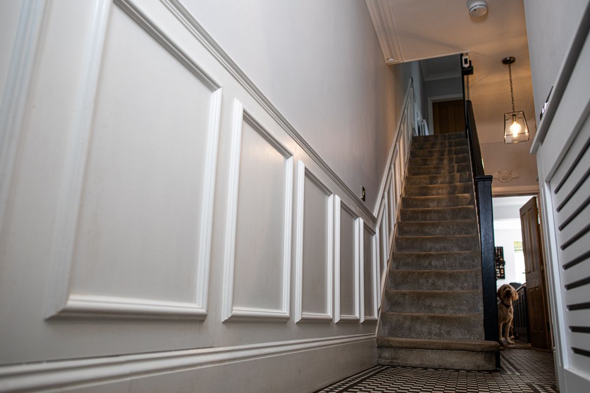 Wooden panelling up staircase